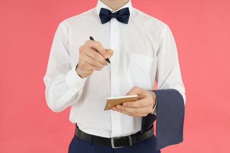 Concept of profession with young man waiterの写真素材