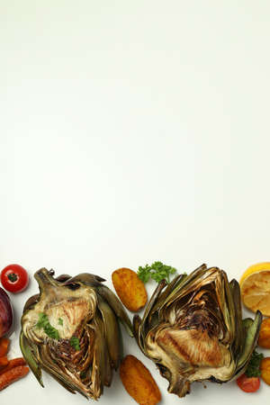 Concept of tasty food with grilled artichoke, space for textの写真素材