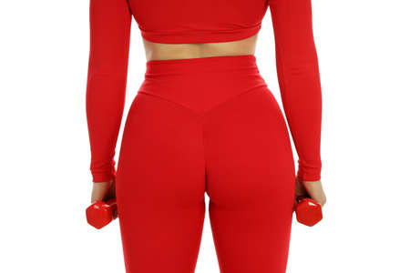 Sporty woman in red outfit isolated on white background