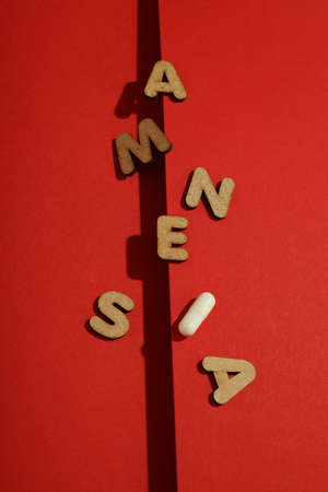 Concept of problems with memory, amnesia disease on red background