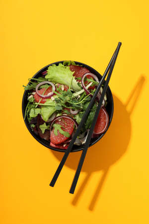 Concept of tasty food, salad with red orange, top view