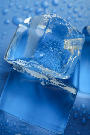 Ice forms on blue background, close up