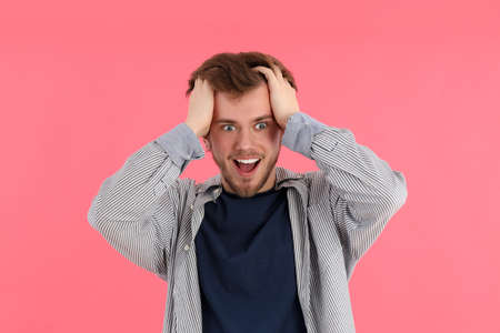 Concept of people with young man on pink background