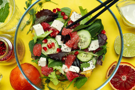 Concept of tasty food, salad with red orange, close up