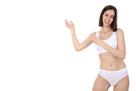 Concept of weight loss, young woman isolated on white backgroundの写真素材