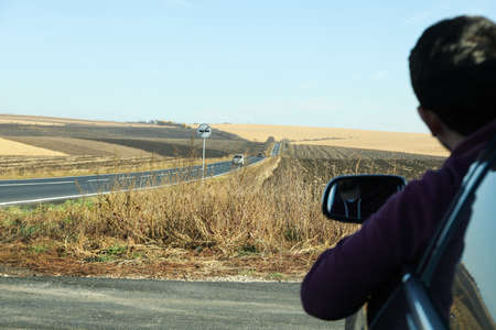 Concept of travel and adventure, man sit in car