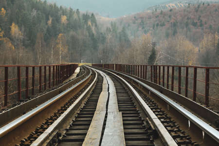 Concept of travel and adventure, railroad in mountainsの写真素材