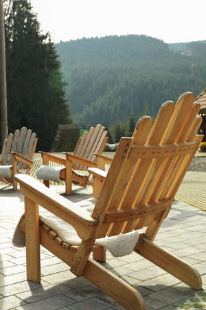 Wooden chairs for relaxing outdoors in mountain resortの写真素材