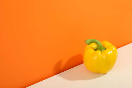 Fresh bell pepper on two tone background