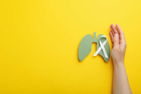 Lung Cancer Awareness Month concept on yellow backgroundの写真素材