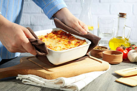 Concept of cooking, composition of cooking Lasagna on gray textured tableの写真素材