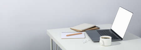 Concept of workplace on white table, space for textの写真素材