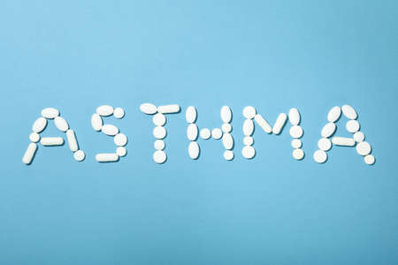 Word Asthma made of pills on blue backgroundの写真素材