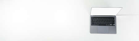 Open laptop on white background, space for text