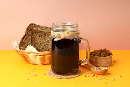 Concept of fresh drink on orange table against pink background, kvassの写真素材