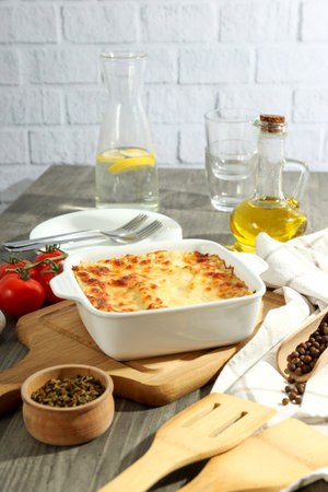 Concept of cooking, composition of cooking Lasagna on gray textured tableの写真素材