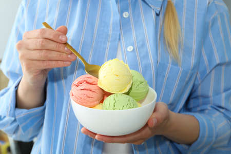 Concept of summer food, woman eats ice creamの写真素材