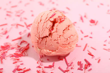 Ice cream on pink background with sprinkles