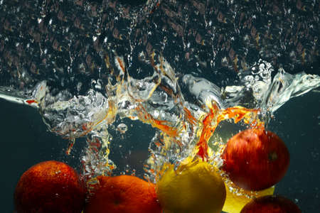 Concept of fresh summer fruits, fruits in water