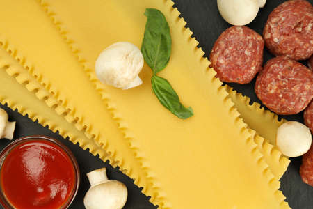 Concept of cooking, cooking lasagna, close upの写真素材