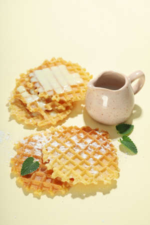 Concept of tasty food with wafers on beige background