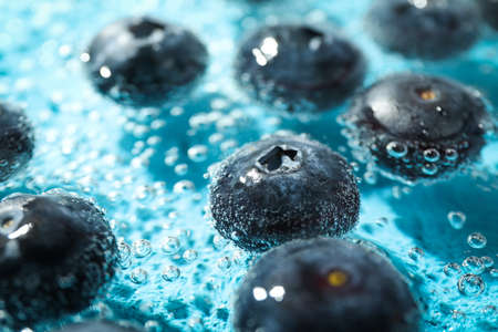 Concept of fresh summer fruits, blueberry in waterの写真素材