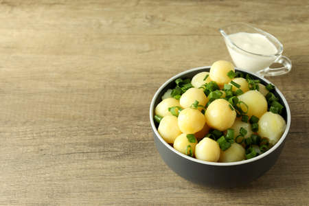 Concept of tasty food with boiled young potatoes, space for textの写真素材
