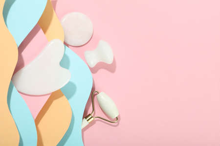 Face care concept with gua sha kit on multicolor backgroundの写真素材