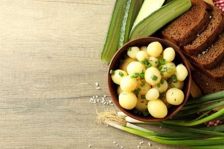 Concept of tasty food with boiled young potatoes, space for textの写真素材