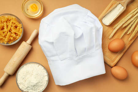 Concept of cooking food with chef hat, top viewの写真素材