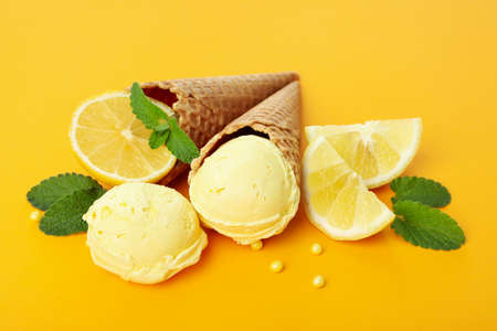 Lemon - mint ice cream on orange backgroundの写真素材