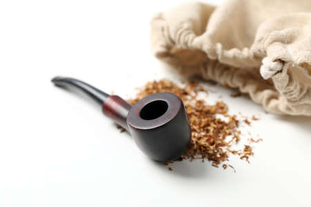 Smoking pipe, tobacco and sack on white backgroundの写真素材