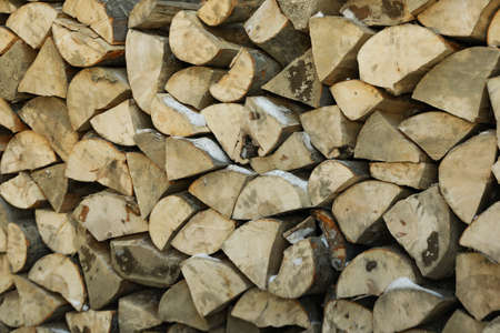 Firewood background, natural firewood folded outdoor for using in winter
