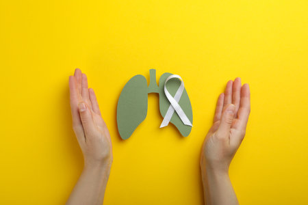 Lung Cancer Awareness Month concept on yellow backgroundの写真素材