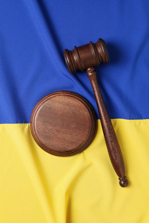 Ukrainian flag with judges gavel and soundboardの写真素材