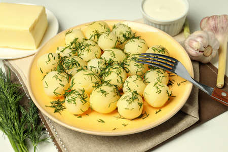 Concept of tasty food with boiled young potatoes, close upの写真素材
