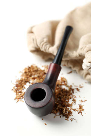 Smoking pipe, tobacco and sack on white backgroundの写真素材