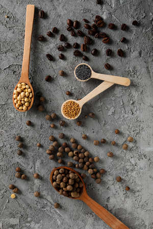 Different ingredients for cooking on gray textured background
