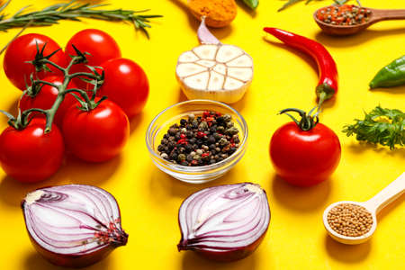 Different ingredients for cooking on yellow backgroundの写真素材