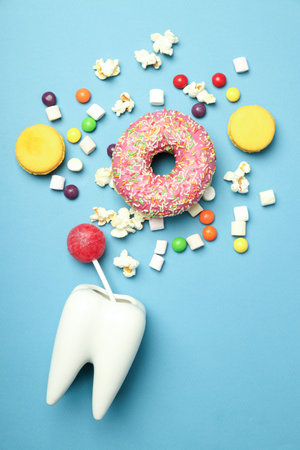 Concept of food bad for teeth on blue backgroundの写真素材