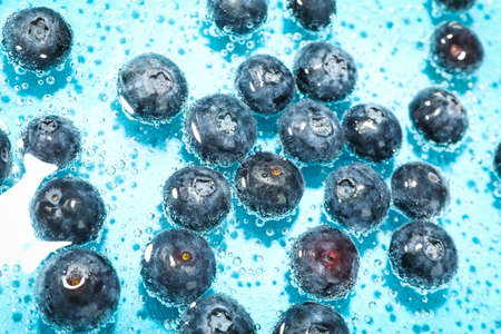 Concept of fresh summer fruits, blueberry in waterの写真素材