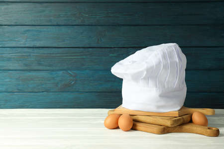 Composition with chef hat for concept of cooking, space for text