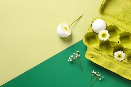 Concept of spring, eggs with flowers, space for textの写真素材