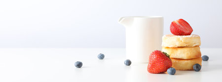 Concept of tasty sweet food, cheese pancakes, space for textの写真素材