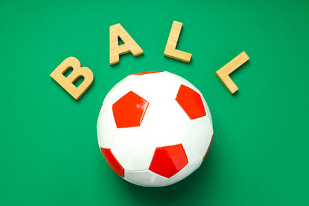 Word Ball and football ball on green backgroundの写真素材