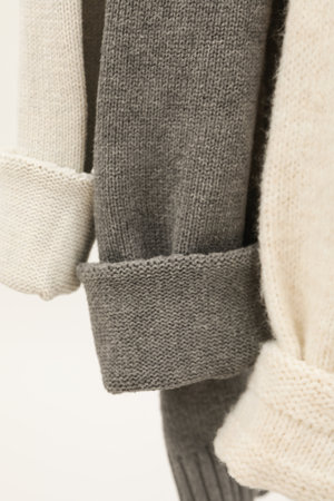 Hanging sweaters, concept of autumn season clothes