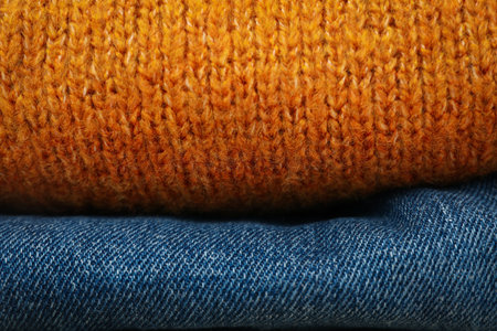 Folded autumn clothes, concept of autumn season clothesの写真素材