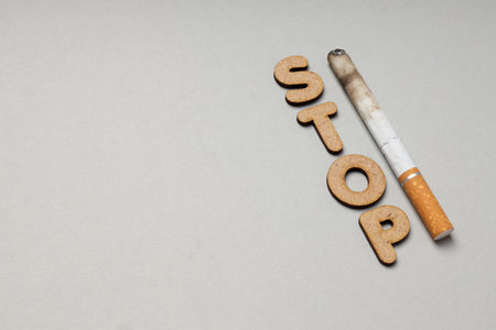 text Stop and cigarette, space for textの写真素材