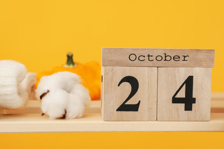 Wooden calendar with 24 october, concept of autumn seasonの写真素材