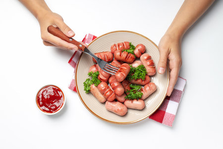 Concept of tasty food, grilled mini sausage, top viewの写真素材